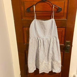 Blue and white striped dress with embroidered trim